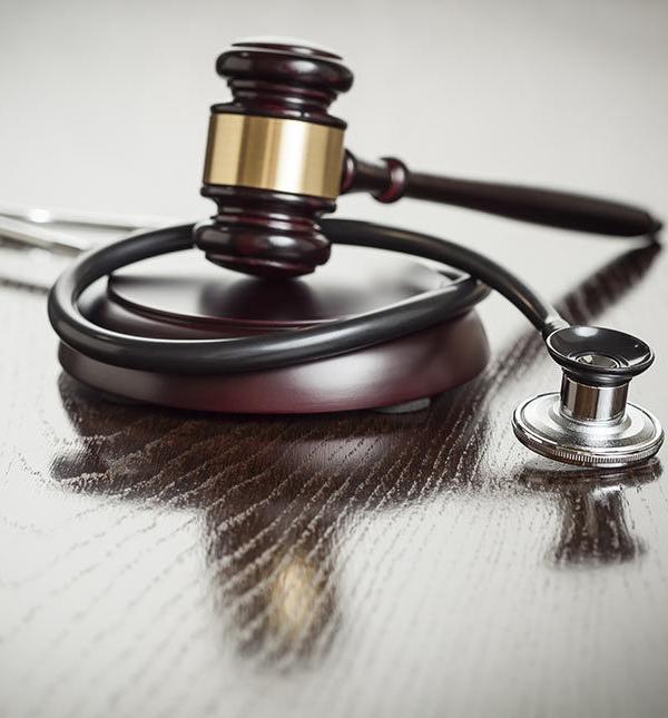 a gavel and a doctor's stethoscope